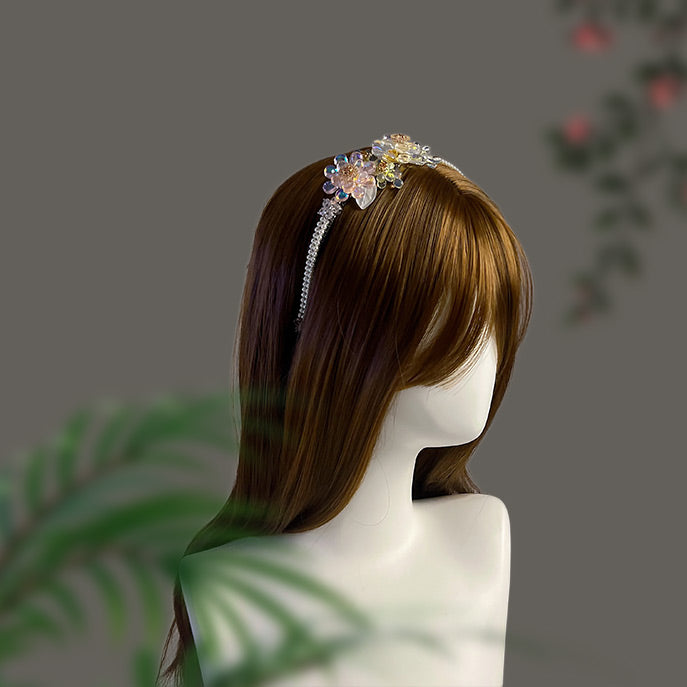 Side profile of a bride wearing the sparkling Liuli and pearl floral headband.