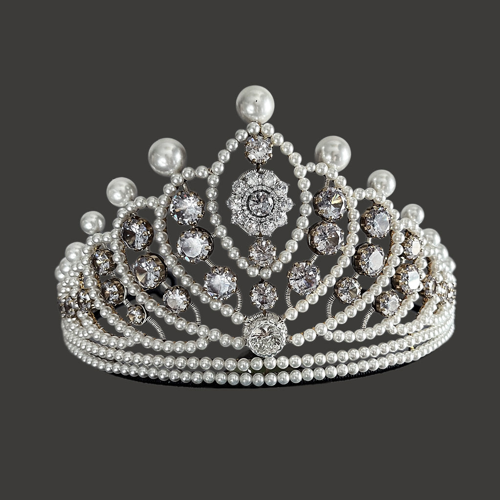 Handmade silver bridal crown featuring lustrous pearls and brilliant-cut crystals, front view.