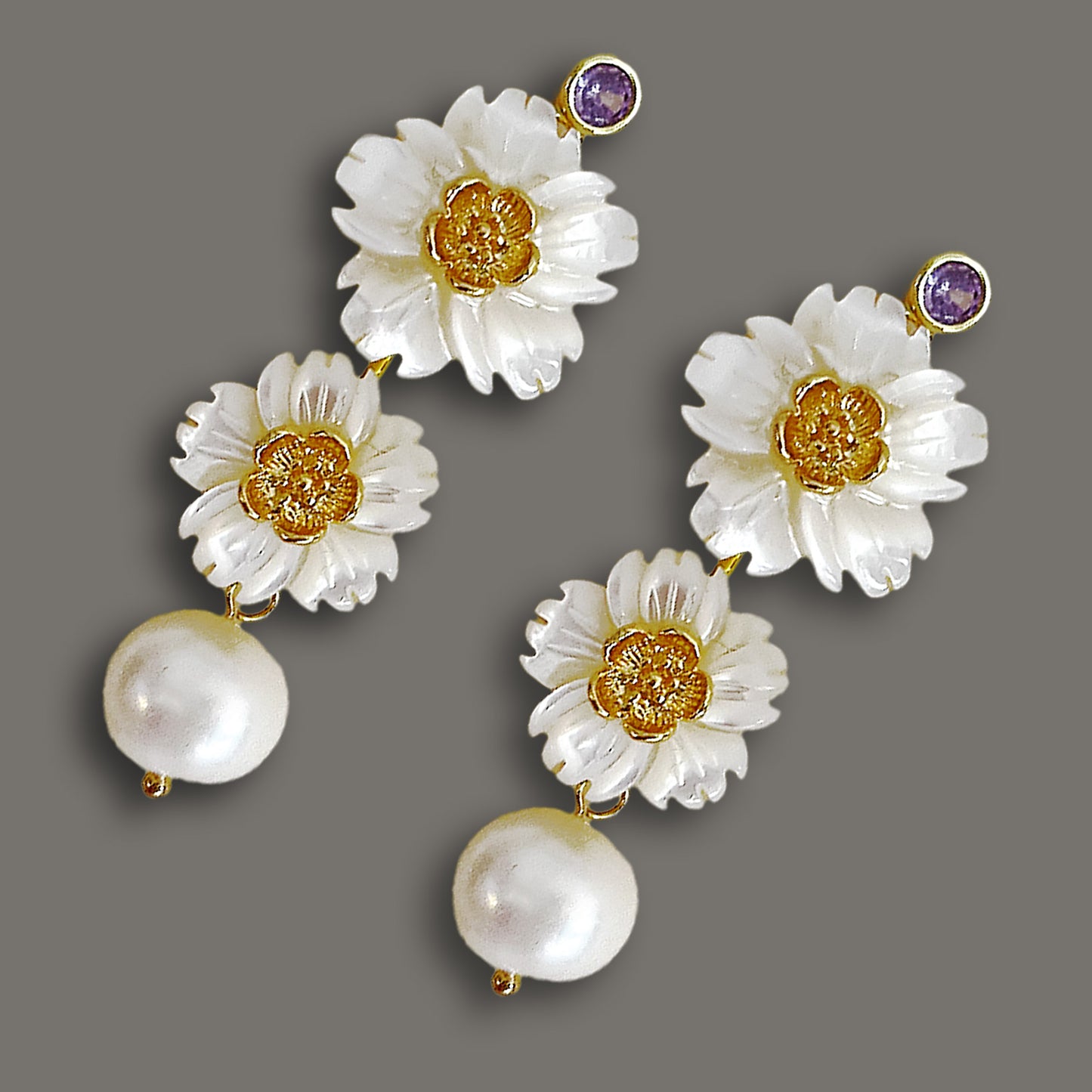 Luminous bloom mother-of-pearl drop earrings with purple gemstone accents