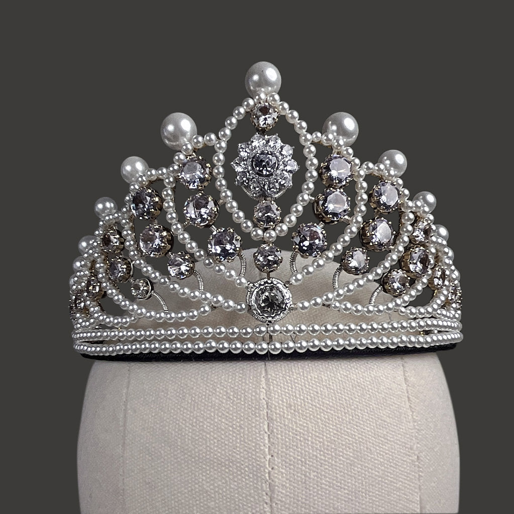 Close-up detail of the hand-wired pearls and premium crystals on a bespoke silver bridal crown.