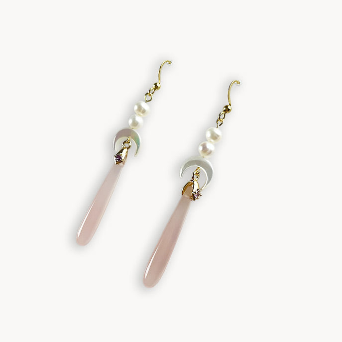 Elegant Celeste long drop hook earrings with pink agate and mother of pearl moon accents isolated on a clean white background.
