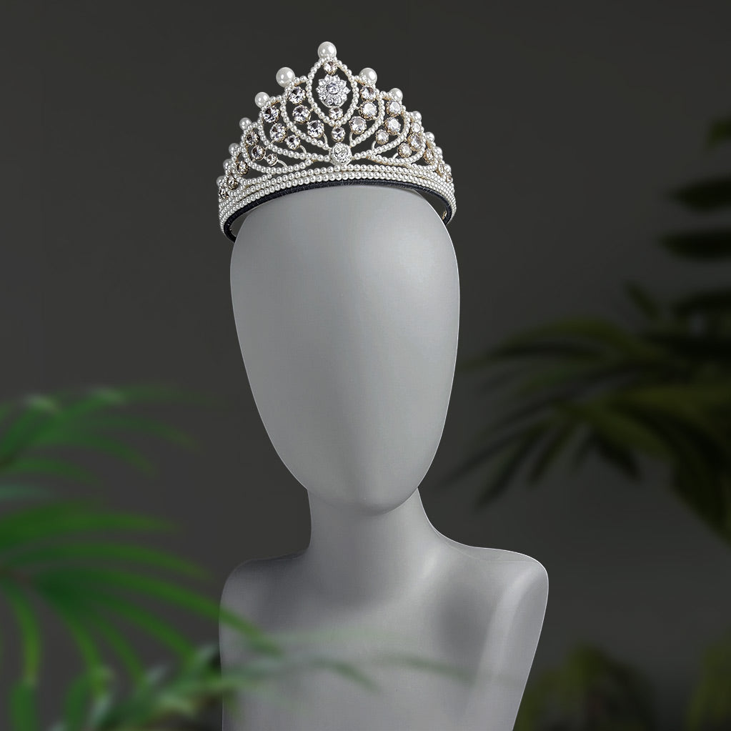 Elegant silver crystal and pearl wedding tiara worn on a display mannequin, front view.
