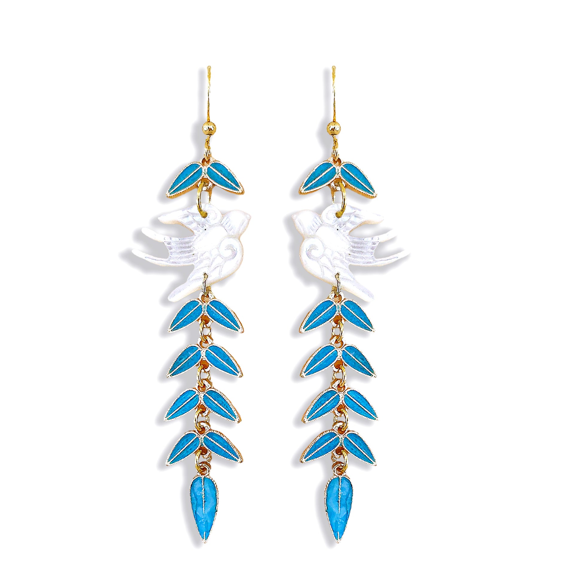 Handcrafted flying swallow and cascading blue leaf drop earrings isolated on white background