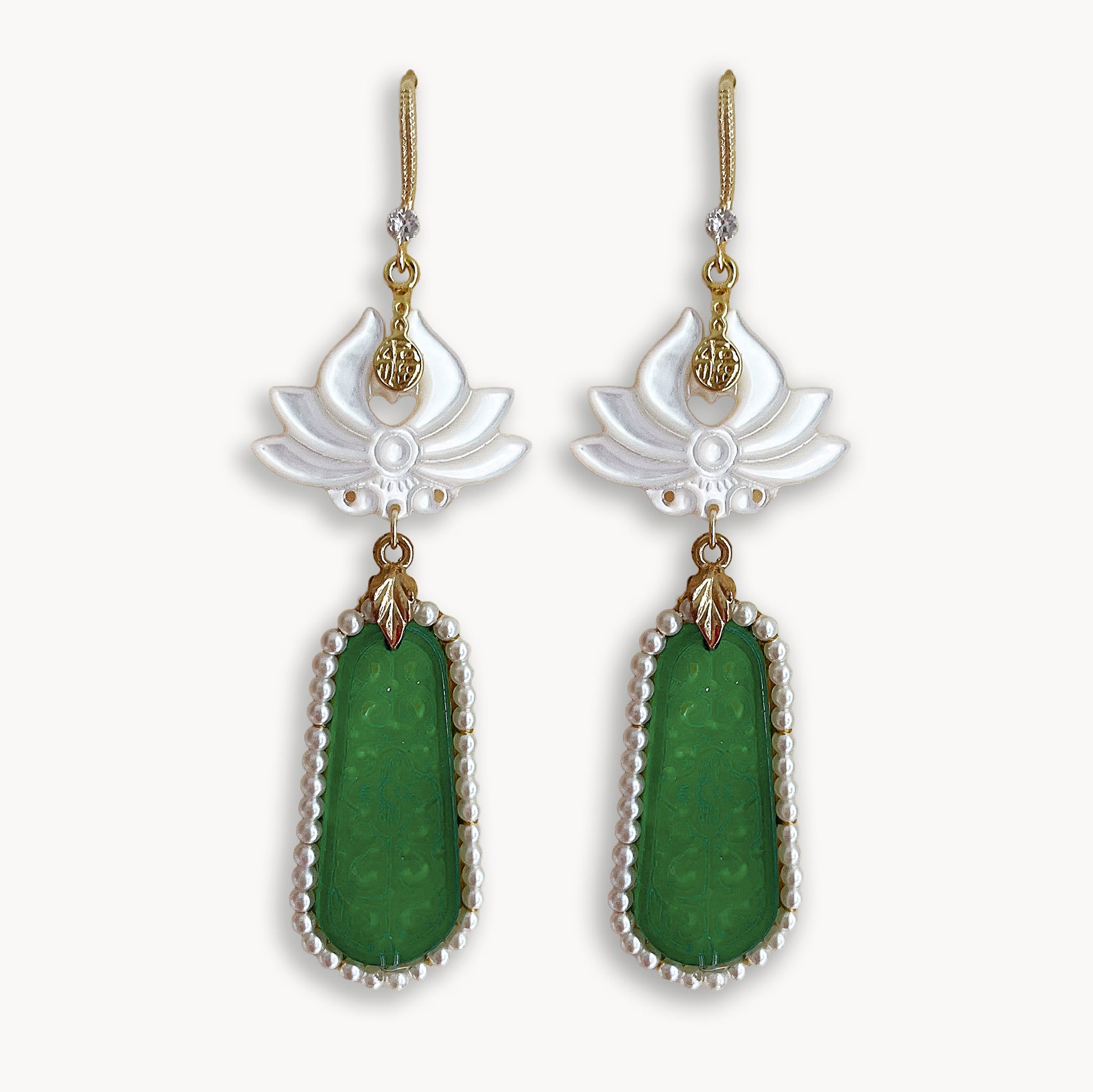 legant handcrafted white flower and green geometric dangle earrings isolated on pure white background